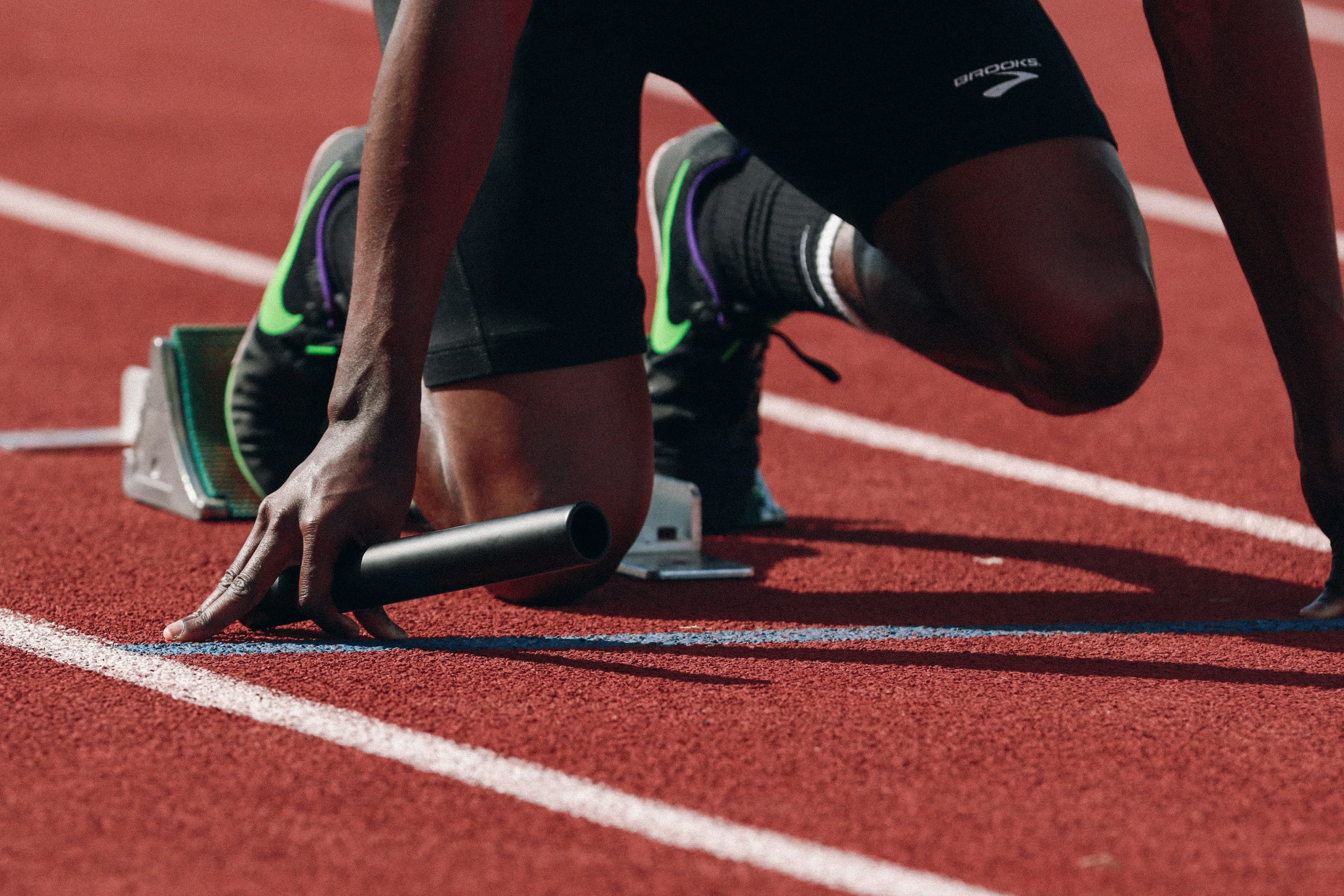 A picture of an athlete getting ready to run a race